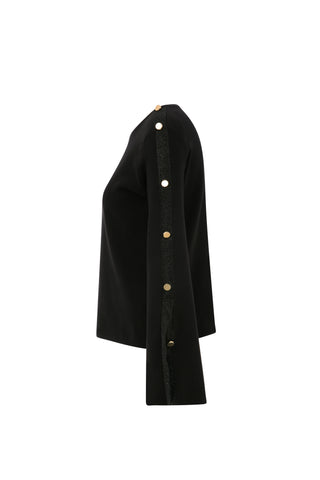 Long-sleeved black knit sweater with button detail
